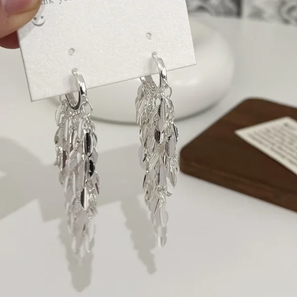 Silver tone leaf tassel earrings